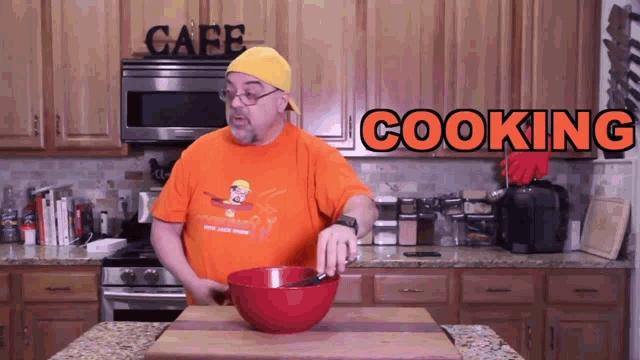 a man in a kitchen with the word cooking in orange
