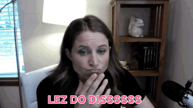 a woman is making a funny face and the words lez do disssss are above her