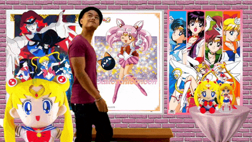a man stands in front of a sailor moon poster on a brick wall