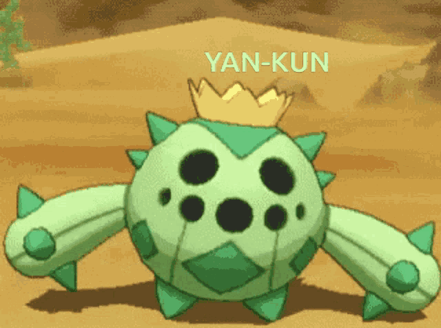 a green cartoon character with a crown and the name yan-kun on the bottom