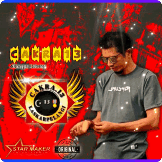 a man wearing glasses and a t-shirt that says cakra 13 on it