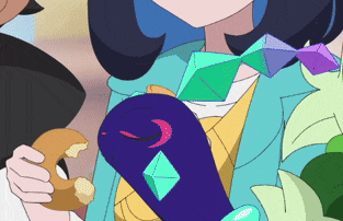 a girl in a blue jacket is holding a donut in her hand