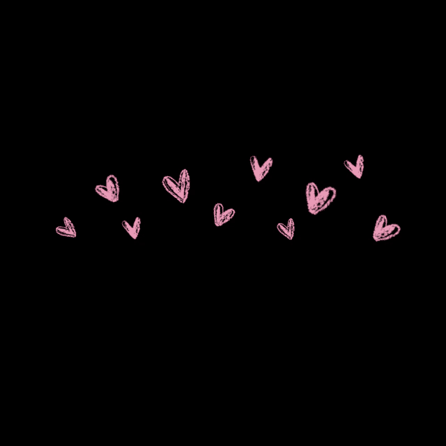 a row of pink hearts on a black background .