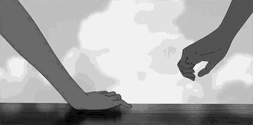 a couple of hands reaching out towards each other .