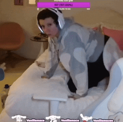 a person wearing headphones sits on a bed with a purple sign that says 157 ( 167.00 )