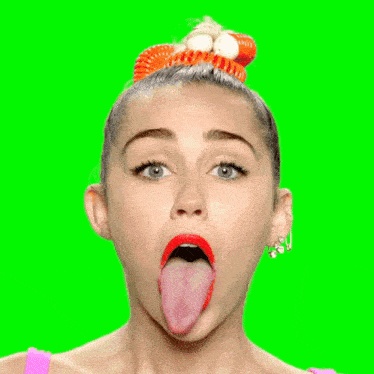 a woman sticking her tongue out with a garfield headband on her head