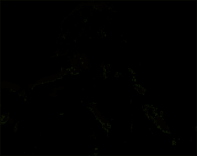 a man without a shirt is standing in a dark room with green lights .