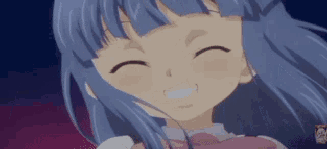 a close up of a cartoon girl with blue hair smiling and looking at the camera .