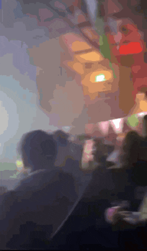 a blurry picture of a person in a car with the number 1 on the ceiling