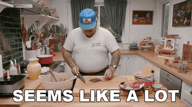 a man prepares food in a kitchen with the words seems like a lot above him