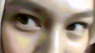 a close up of a woman 's eyes with a grid pattern