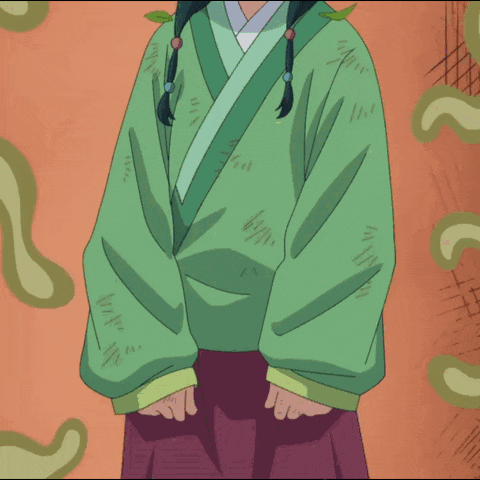 a girl in a green kimono has leaves in her hair