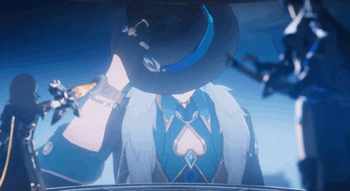 a man wearing a black hat with a blue ribbon around the brim