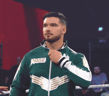a man in a green jacket with a crown on the sleeve