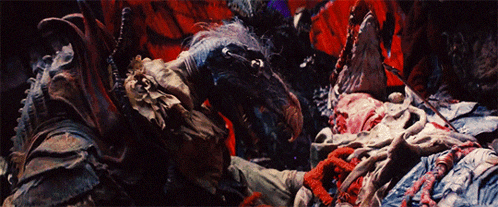 a painting of a monster laying on a bed with a red background