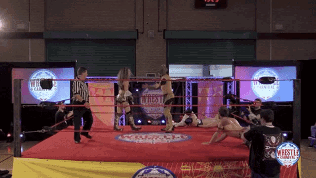 a wrestling ring has a sign that says wrestle carnival