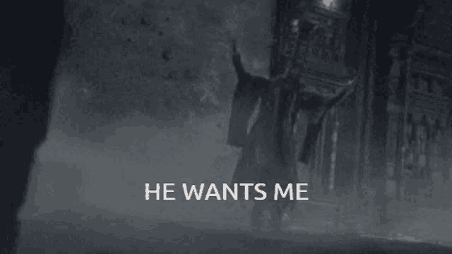 a black and white photo of a man with the words he wants me below him