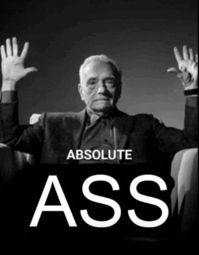 a black and white photo of a man with his hands in the air and the words " absolute ass "