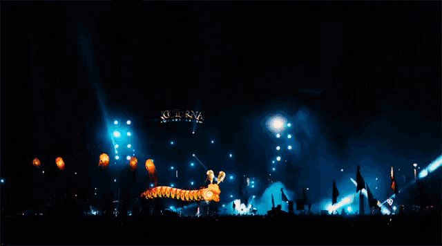 a crowd of people gathered in front of a stage that says nocturnal festival