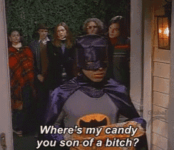 a man in a batman costume is asking where 's my candy you son of a bitch '