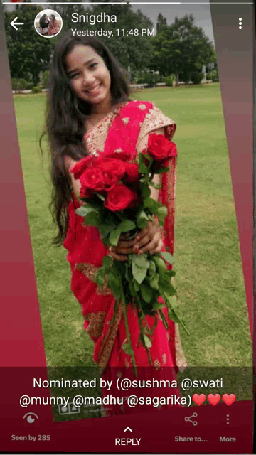 a woman in a red sari is holding a bouquet of roses