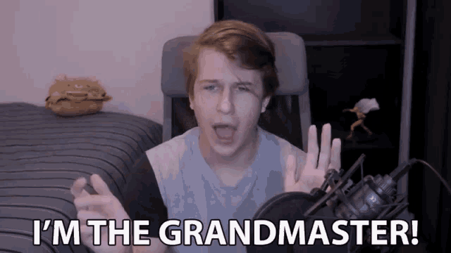a young man says i 'm the grandmaster while standing in front of a microphone