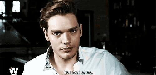 a young man in a white shirt says because of me