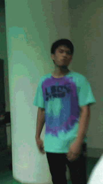 a young man wearing a t-shirt that says let 's do this