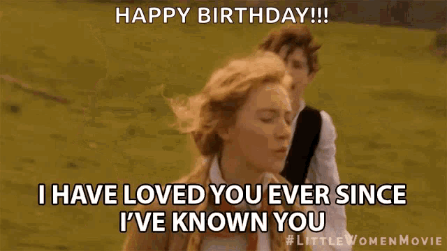 a man and a woman are running in a field and the man says happy birthday !