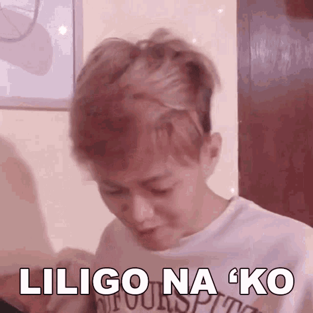 a man with red hair is wearing a white shirt that says ' liligo na ko ' on it