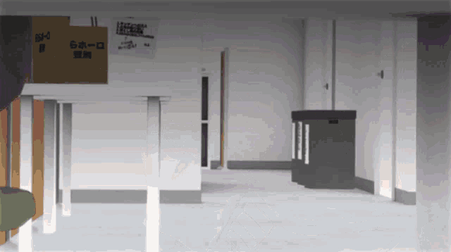 an empty room with a cardboard box on the wall that says ' a ' on it