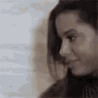 a close up of a woman 's face with her eyes closed