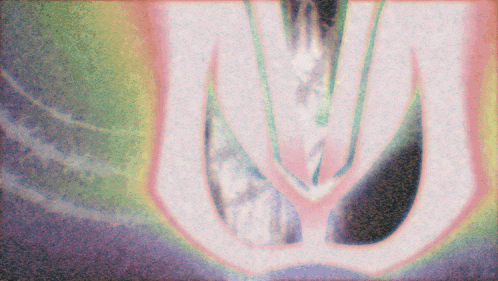 a blurry picture of a person 's torso with a rainbow of colors