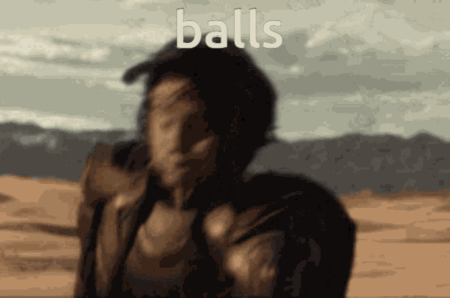 a blurry picture of a man with the word balls written on it