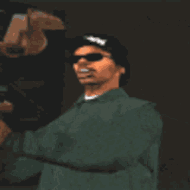 a man wearing sunglasses and a hat that says eazy e on it