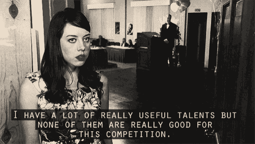 a woman is standing in a hallway with a caption that says i have a lot of really useful talents but