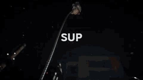 a woman is hanging upside down in the air while holding a gun in a video game .