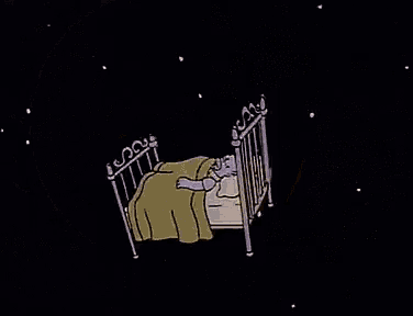 a cartoon of a moon sleeping in a bed with the words gute nacht below it .