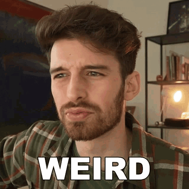 a man in a plaid shirt with the word weird written on his face