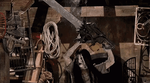 a woman is holding a chainsaw over her head in a room .