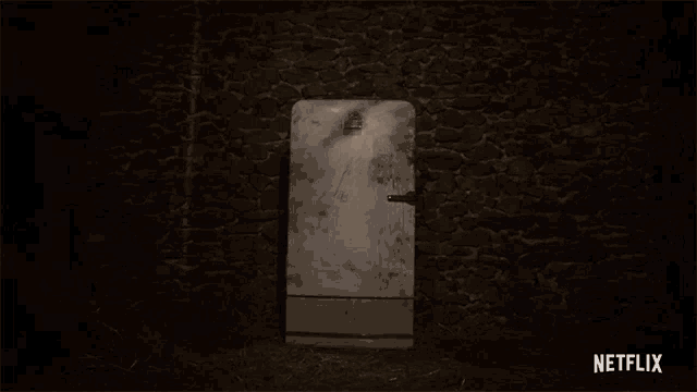 a netflix ad shows a dirty door in a stone wall