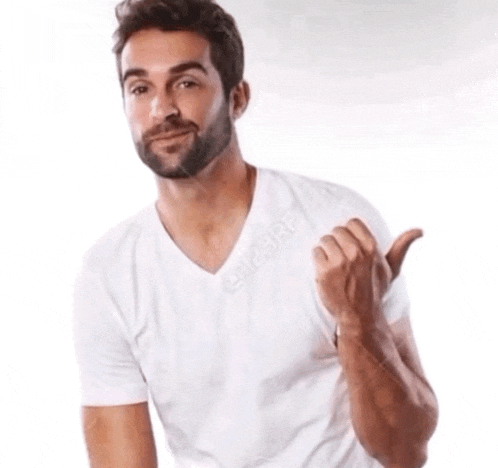 a man with a beard wearing a white t-shirt is giving a thumbs up sign