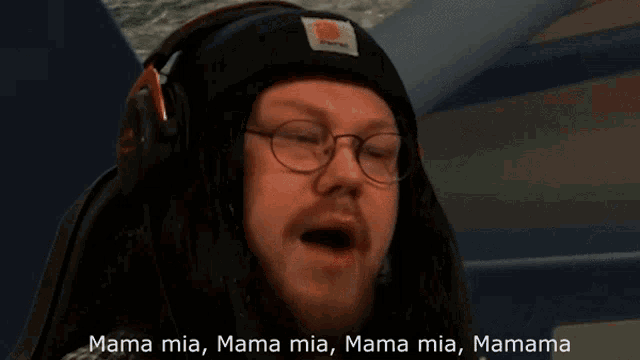 a man wearing headphones says mama mia