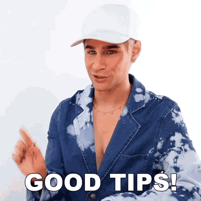 a man wearing a tie dye jacket and a white hat says " good tips "