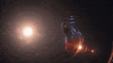 a space ship is flying through a galaxy in outer space