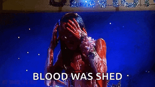 a person with blood on their face is holding their head and says `` blood was shed '' .
