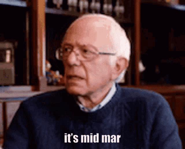 an elderly man wearing glasses and a blue sweater says it 's mid mar