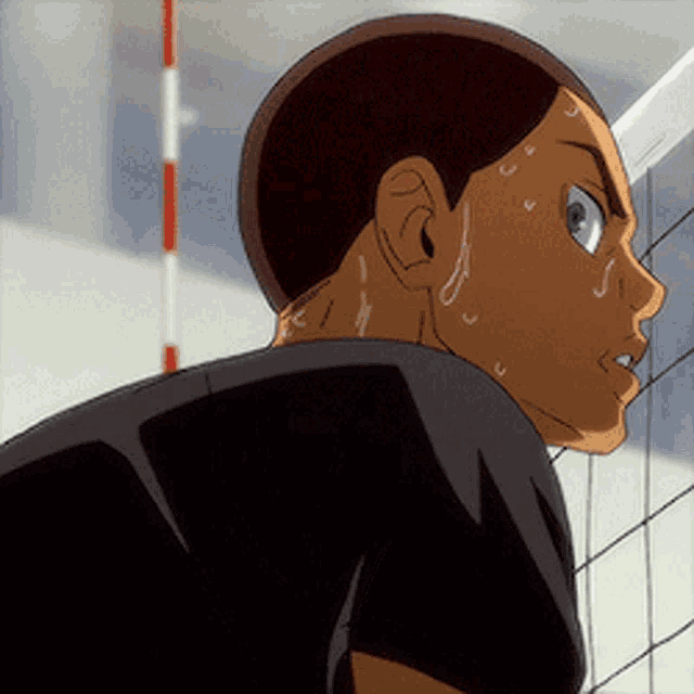 a man in a black shirt is sweating and looking at something