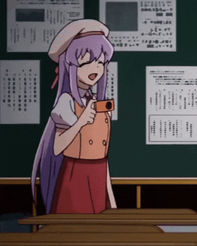 a girl with purple hair is holding a camera in front of a green board