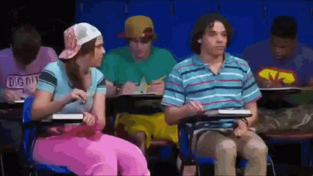 a group of students are sitting in a classroom with one wearing a shirt that says diggin